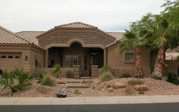 A house and yard with xeriscaping.